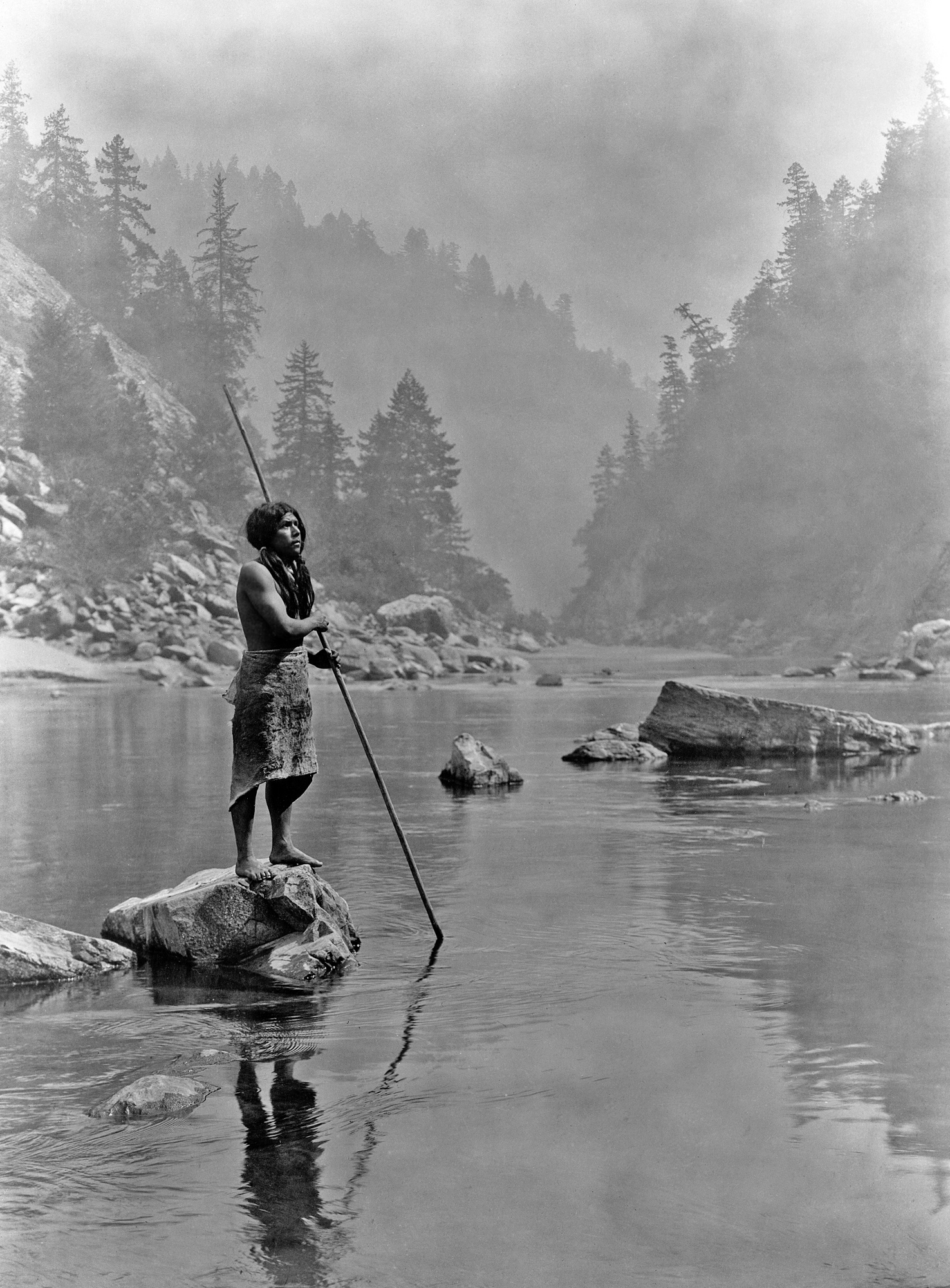 native american using a spear arrowhead to spear fish look for arrowheads in creeks and rivers where to look for arrowheads