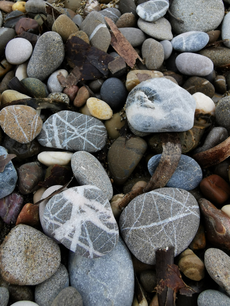 wishing stones on gravel river bank