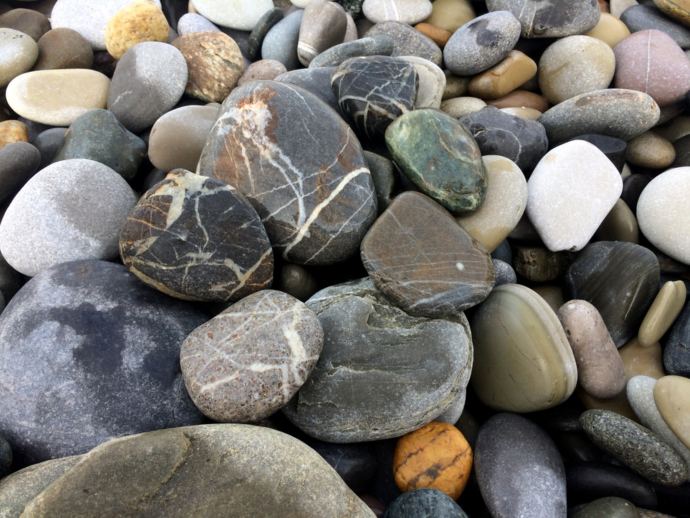 wishing stones on rocky beach