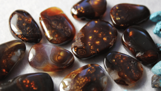 collection of cut and polished fire agate stones